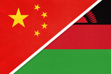 China or PRC vs Malawi national flag from textile. Relationship between Asian and African countries.