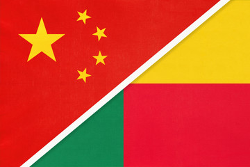 China or PRC vs Benin national flag from textile. Relationship between Asian and African countries.