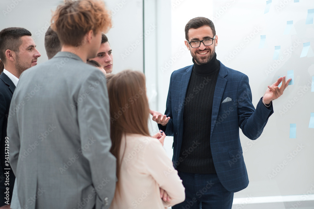 Wall mural group of employees enthusiastically discussing new ideas.