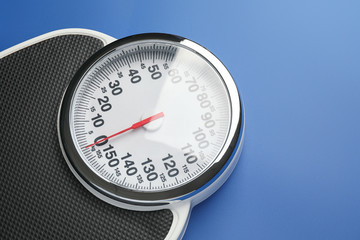 Weight scales on color background. Slimming concept