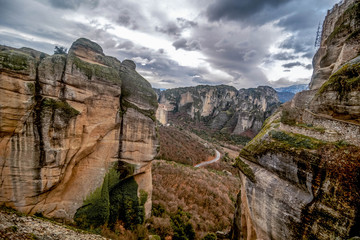 Scenic view of mountain cliffs with walkways in winter