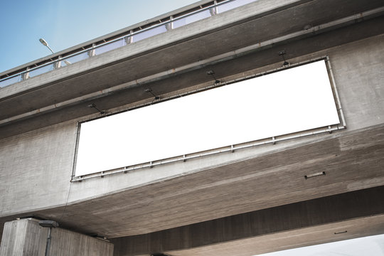 Advertisement Concept - Big White Billboard Template On Concrete Bridge