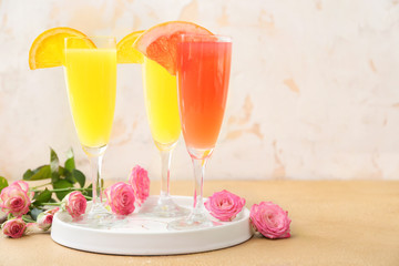 Glasses of tasty mimosa cocktail on table