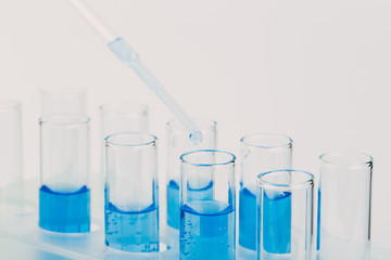 A pipette that adds fluid to one of several tubes. Lab tests