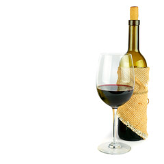 Bottle and glass of red wine isolated on a white background. Free space for text.