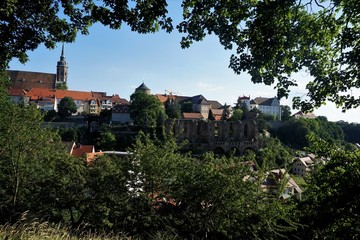 The old town of Bautzen hidden behind trees and bushes