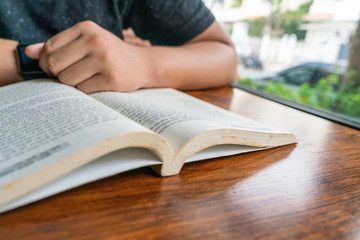 Close up photo of man reading book