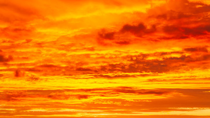 The texture of the cloudscape with an orange sky. Sunrise sky with orange clouds.