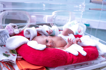 Newborn  in incubator ICU