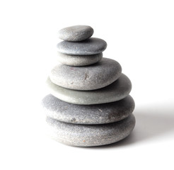 Pyramid of sea stones on a white