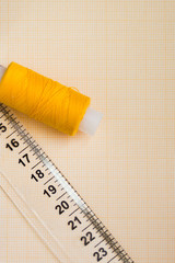 thread in spools and cutter line for sewing