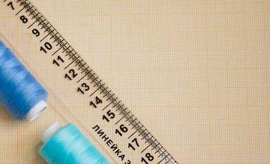 thread in spools and cutter line for sewing