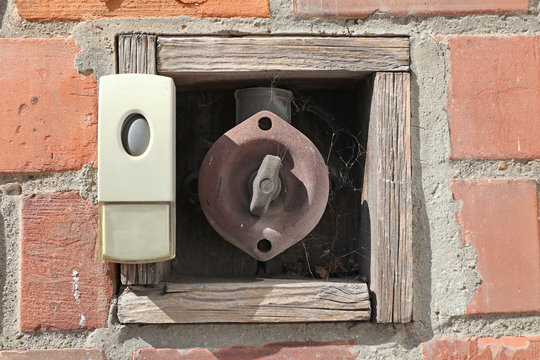 Dangerous old bell button on the wall