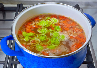 onion soup cooked in a pan in the kitchen