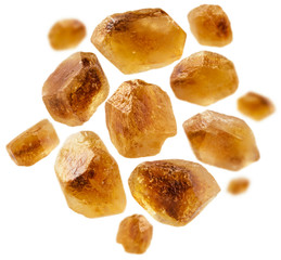 Caramelized sugar levitates on a white background