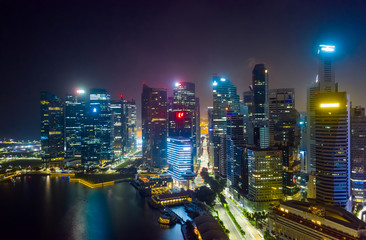 Fototapeta na wymiar Aerial drone view of Singapore business district and city, Business and financial district Modern building in the city center of Singapore on February 2, 2020 in Singapore.
