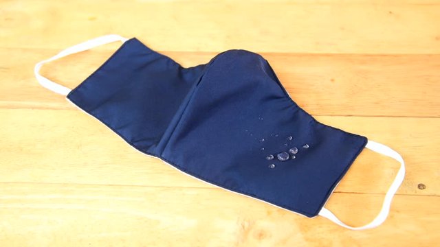 Drop of water on cloth mask for protect from covid-19 / cloth mask 