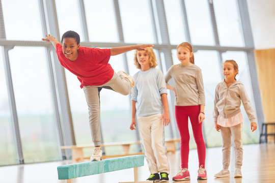 Children On Balance Beam Train Coordination