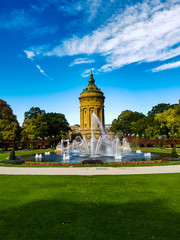 Wasserturm water storage tank Mannheim flowers green grass monument fountain park walk sunny day...