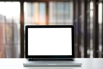 Fototapeta premium Laptop with blank screen for product display on desk in home.