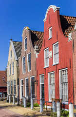 Fototapeta premium Red brick house with clock gable in Harlingen, Netherlands