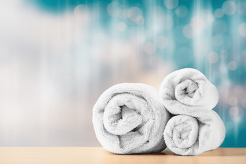 Obraz na płótnie Canvas Two folded towels for spa massage. Spa treatment concept.