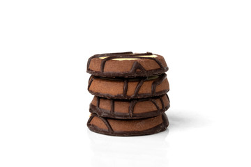 Chocolate cookies with milk filling isolated on white background.