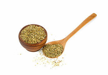 dried oregano in wooden bowl and spoon isolated on a white