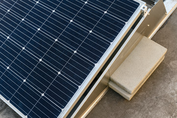 Load using a tiled solar panel holder on the roof.