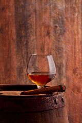 Glass of cognac and cigar