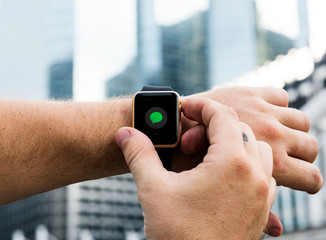 Man checking messages on the go on his smartwatch