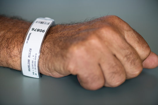 Patient earing an identification wristband in the intensive care unit