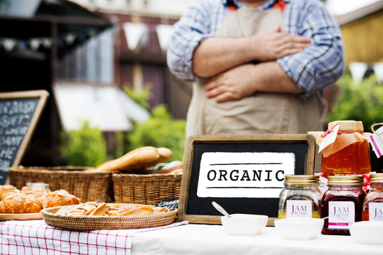 Farmer selling organic produce at a local fresh market