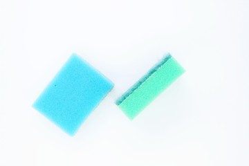 Sponges for washing dishes located on a white background