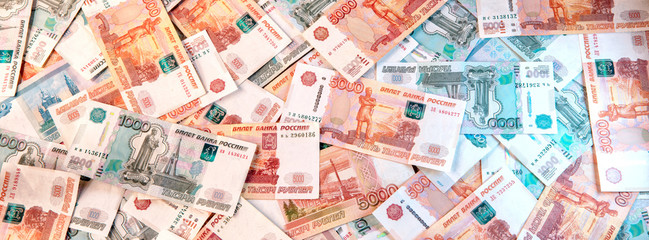 Background of banknotes of five and one thousand Russian rubles