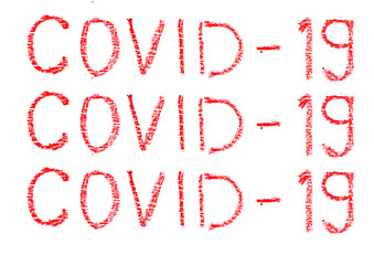 
COVID-19 inscription painted with a wax pencil on a white background