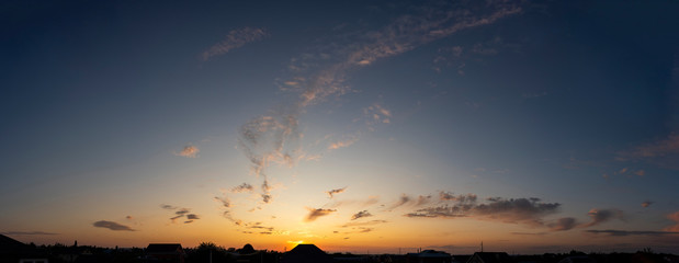 Obraz na płótnie Canvas Sunset panorama with clouds high resolution