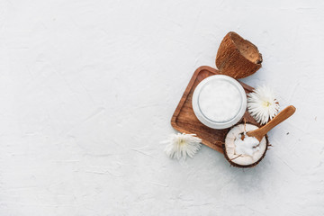 Organic coconut and wooden spoon. Coconut body care concept