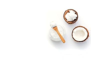 Top view Organic healthy coconut butter with fresh coconut pieces over  white background