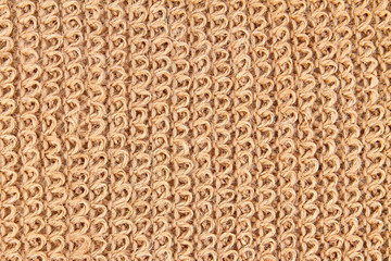 Background or texture of Natural eco-friendly Brown jute washcloth. Closeup