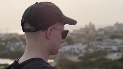 close-up of young blonde man enjoying the view in slow motion