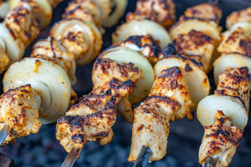 Grilled chicken legs. Food close-up. Barbecue grill picnic. Fresh roasted meat for background.