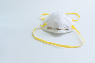 filtering face mask for covid-19 - protection factor for N95 - reduces wearer’s exposure to particles including small particle aerosols and large droplets - safty mask on white background.