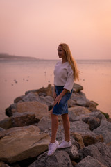 Blonde model on the beach at summer