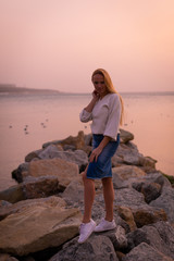 Blonde model on the beach at summer