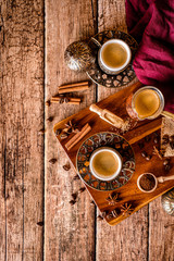 Coffee cups and coffee beans on a natural wood background