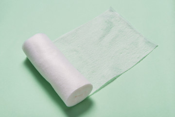 White roll of non woven bandage on  background