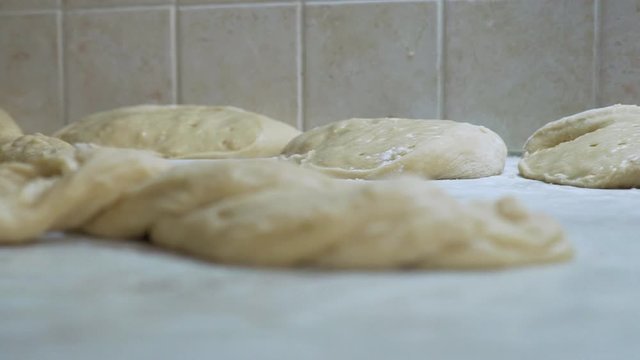 Footage of preparation of greek traditional sweet bread for the Easter called Tsoureki SLOW MOTION pan shot