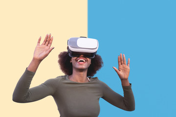 Afro woman using virtual reality glasses outdoor - Happy young girl having fun with innovated vr...