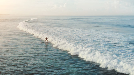 Man In Water. Surfer On White Surfboard Swimming In Ocean At Sunset. Water Sport, Lifestyle Concept On Beautiful Seascape Background. 